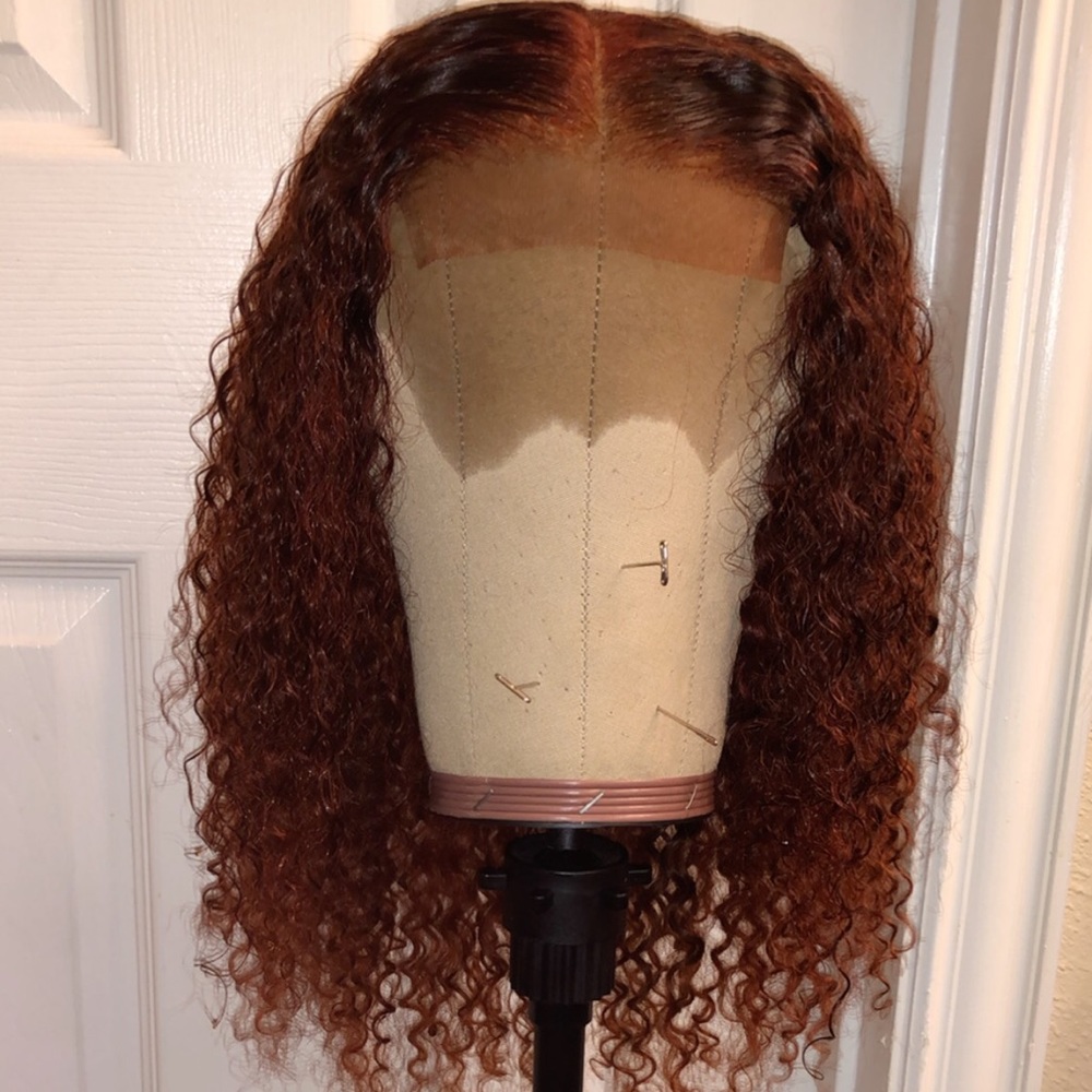 Ginger/copper color curly wig.